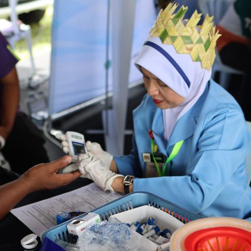 Community members receiving health screening as part of integrated support initiatives.